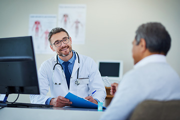 Image showing Doctor, senior man and office consultation for healthcare service, writing notes and listening to health problem. Helping, advice and medical professional on folder, report and chart of patient care