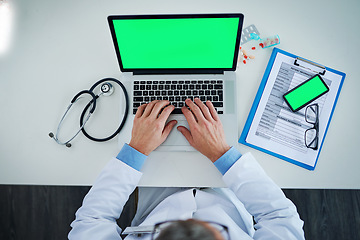 Image showing Laptop, green screen and doctor hands with medicine, documents or healthcare service, research and mockup above. Space, telehealth and pills with medical person typing, phone mock up and computer app