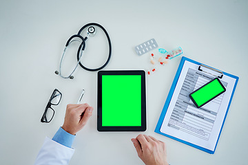 Image showing Tablet, green screen and doctor hands with medicine, documents and healthcare service, research and mockup above. Mock up, space and paperwork, pills and medical person with telehealth application