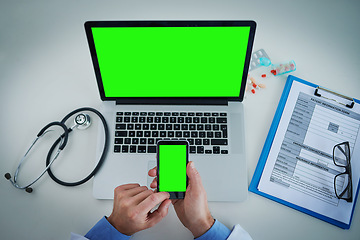 Image showing Phone, green screen and doctor on laptop for healthcare service, online planning and research with hands above. Space, telehealth and pills of medical person typing on mobile app, mockup and computer