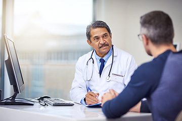 Image showing Medical, discussion and doctor in a consultation with a patient analyzing diagnosis in the clinic. Professional, conversation and mature male healthcare worker talking to man in the medicare hospital