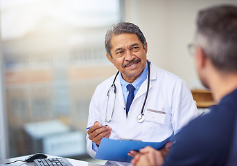 Image showing Healthcare, discussion and doctor with a patient for a consultation in the office in clinic. Professional, conversation and mature male medical worker talking to man on diagnosis in medicare hospital