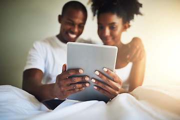 Image showing Tablet, bedroom and happy couple in home with movie, video or communication on social media app. Black man, woman and digital touchscreen in house with reading, online chat or smile at meme together