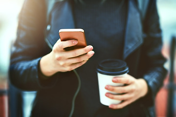 Image showing Hands, coffee and phone for texting in city, internet scroll and web browsing. Cellphone, hand and woman networking, online social media and messaging, website and mobile app outdoor on urban street.