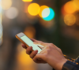 Image showing Hands, bokeh and phone screen in city, internet scroll and web browsing at night mockup space. Cellphone, hand closeup and woman networking, online social media and typing on mobile app for email.