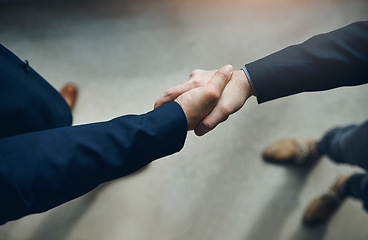 Image showing Handshake, partnership and b2b with business men in the office for agreement, deal or company merger. Meeting, greeting or interview with people shaking hands at work to say thank you from above