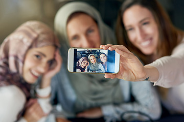 Image showing Muslim women, friends and selfie with phone, smile and happiness for post on blog, app or social network. Happy islamic woman, group and smartphone for photography, profile picture and memory on web