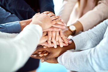 Image showing Team building, collaboration or hands of business people in stack for, partnership, support or community mission. Motivation or closeup of corporate group of workers with goals or target in meeting
