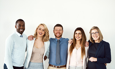 Image showing Business people, portrait hug and smile of lawyers by white wall background mockup in workplace. Face, confident group and standing together with collaboration, diversity and teamwork for cooperation