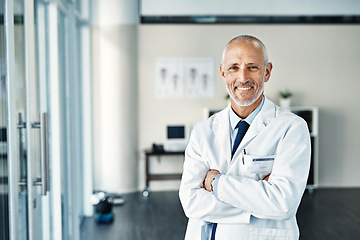 Image showing Mature doctor, worker and portrait with arms crossed in hospital feeling proud from medical work. Healthcare, wellness and physician employee smile with happiness from health support and mockup