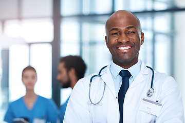 Image showing Man, leader and portrait of doctor in hospital, healthcare or clinic with medical expert nurses to trust in quality care. Black person, face and happy cardio surgeon with confidence in medicine