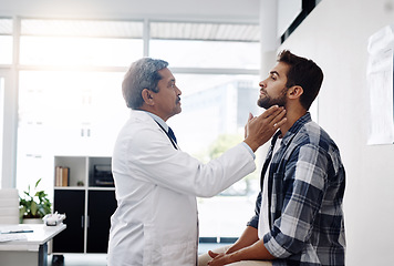 Image showing Healthcare, consultation and doctor checking throat of patient with advice, help and solution. Medicine, health care and Indian man with neck pain in doctors office consulting medical professional.