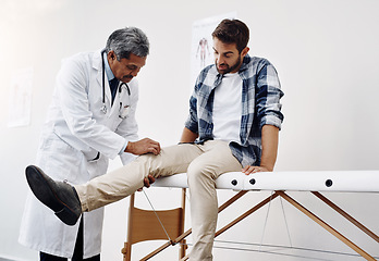 Image showing Knee pain, patient and doctor in clinic, health care and help at wellness checkup of person at hospital. Medicine, healthcare and man with leg injury in doctors office consulting medical professional