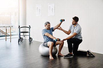 Image showing Dumbbells, physiotherapy and balance with doctor and old man for rehabilitation, training and stretching. Healthcare, wellness and healing with patient and expert for consulting, muscle and exercise