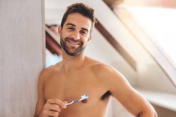 Image showing Portrait, shirtless and happy man brushing teeth in bathroom for dental wellness, healthy smile and body with care at home. Sexy guy, toothbrush and oral cleaning for fresh breath and morning hygiene