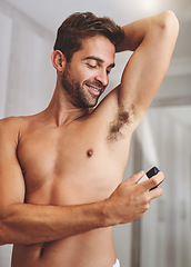 Image showing Deodorant, clean spray and man in bathroom for hygiene, shower and perfume to control underarm sweating. Happy shirtless guy, armpit and fragrance cosmetics for skincare, body product and male beauty