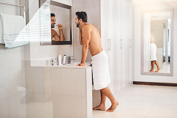 Image showing Happy man, bathroom and brushing teeth at mirror for healthy smile, dental hygiene and gum care. Shirtless guy, shower and cleaning mouth with toothbrush for fresh breath, grooming or morning routine