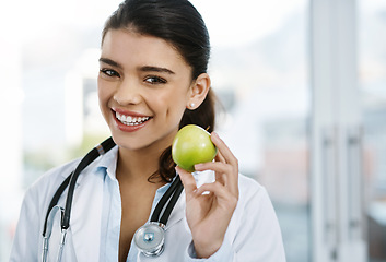 Image showing Portrait, doctor and happy woman with apple for healthy diet, nutrition or wellness. Face, nutritionist or medical professional with fruit for vitamin c, healthcare or natural food for vegan benefits