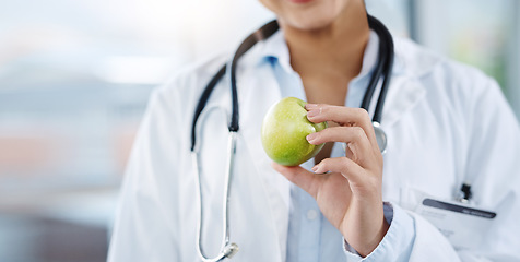 Image showing Doctor, hands and woman with apple for healthy diet, nutrition or wellness. Medical professional, nutritionist or person with fruit for vitamin c, healthcare or natural food for vegan health benefits