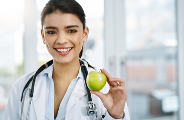 Image showing Doctor, portrait and smile of woman with apple for nutrition, healthy diet or wellness. Face, nutritionist and medical professional with fruit for vitamin c, healthcare and food for vegan benefits.