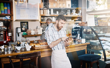 Image showing Tablet, small business and barista doing inventory while working on startup plan in restaurant. Technology, entrepreneur and male cafe owner and waiter doing research on digital mobile in coffee shop