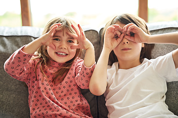 Image showing Portrait, siblings and sisters on a couch, funny and facial expression with happiness, bonding and loving. Face, female children or young people with joy, silly and goofy with a smile, home and relax