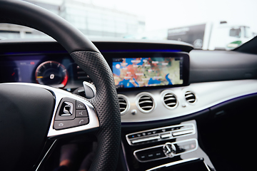 Image showing Control buttons on steering wheel. Car interior.