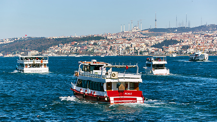 Image showing Istanbul, Turkey - 1 April, 2017: Passenger ships crossing Bosporus at spring day