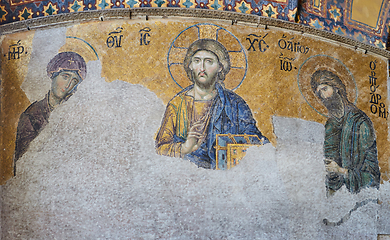 Image showing 13th century Deesis Mosaic of Jesus Christ flanked by the Virgin Mary and John the Baptist in the Hagia Sophia temple in Istanbul, Turkey.