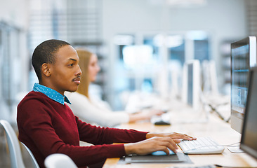 Image showing Education, university and student in the library computer or studying on desktop or doing exams on the internet and in college. Research, learning and scholar reading or academic and online course