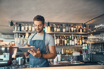 Image showing Man in restaurant, tablet and small business with inventory check, entrepreneur in hospitality industry and connectivity. Male owner, scroll and cafe franchise with digital admin and stock taking