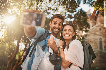 Image showing Couple, tourist and selfie outdoor travel in a city with holiday memory and happiness. Happy man and woman together for adventure, social media or vacation photo and freedom with love and care