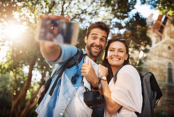 Image showing Tourist couple, smile and selfie outdoor for travel in a city for vacation memory or happiness. Happy man and woman take picture on adventure, social media or holiday trip with freedom, love and care