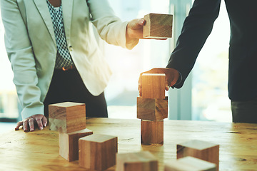 Image showing Teamwork, man and woman in office with building blocks, design ideas and problem solving challenge. Engineering, planning and strategy, wood block game and team of business people working together.