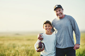 Image showing Father, kid portrait and rugby ball in countryside field for bonding and fun in nature. Mockup, dad and young child together with happiness and smile ready for sporty active game outdoor on farm