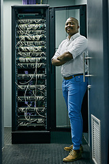 Image showing Server room, confident black man or portrait of technician with cables for online cyber security or hardware cords. IT support, happy or proud African engineer fixing wires for information technology