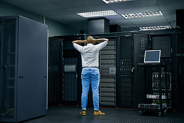 Image showing Server room, IT support or electrician with a hardware problem stressed with maintenance or glitch crisis. Confused or back of worried technician or electrical engineers in information technology