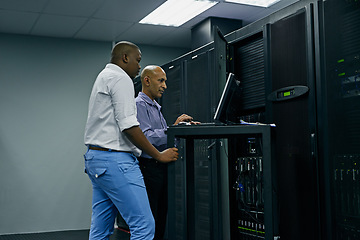 Image showing Server room, people or technicians coding on computer together for a cybersecurity glitch with teamwork. IT support code, collaboration or engineers fixing pc network for information technology