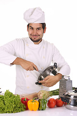 Image showing young chef preparing lunch 