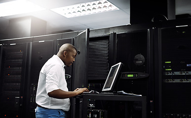 Image showing Server room, black man or coding on computer for programming or digital error in data center. Cybersecurity, support or technician typing online for fixing, troubleshooting or software development