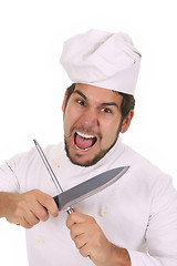 Image showing Mad chef sharpening a knife 