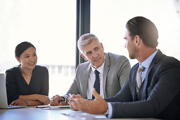 Image showing Meeting, collaboration and strategy with a manager and team in the boardroom for a coaching seminar. Teamwork, planning and workshop with a mature CEO business man talking to his staff in the office