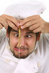 Image showing funny chef cracking an egg