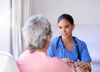 Image showing Comfort, healthcare and caregiver with senior patient explaining diagnosis after consultation. Medical, support and female nurse volunteer giving advice to elderly lady in retirement at nursing home.