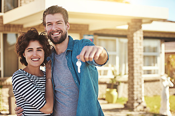 Image showing Keys, new home and portrait of a couple outdoor at a real estate property with pride for buying a house. Happy woman and a excited man moving in together with mortgage and housing loan goal or dream