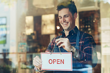 Image showing Open sign, cafe and man with business, startup and poster with service, board and franchise window. Male person, happy employee and entrepreneur with a waiter, new and opening store with hospitality