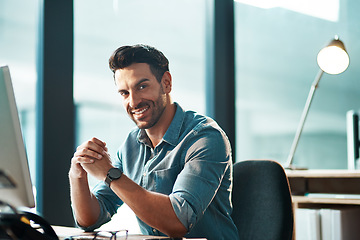 Image showing Business man, portrait and smile at desk in office with confidence, happiness and commitment to company. Happy male entrepreneur at computer in startup agency with pride, professional and motivation