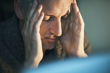 Image showing Headache, stress and mature man with depression, pain anxiety due to burnout in the dark feeling sad. Night, mistake or fail by depressed or frustrated person working overtime in an office