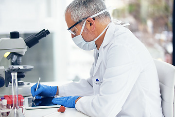 Image showing Science, tablet and scientist writing results of a vaccine in after medical exam in a lab or laboratory. Medicine, research and healthcare man or chemistry professional with solution for covid