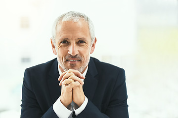 Image showing Portrait, smile and senior man in office happy, confident and empowered on white background. Face, confidence and elderly male CEO cheerful at desk, proud and satisfied with his corporate career